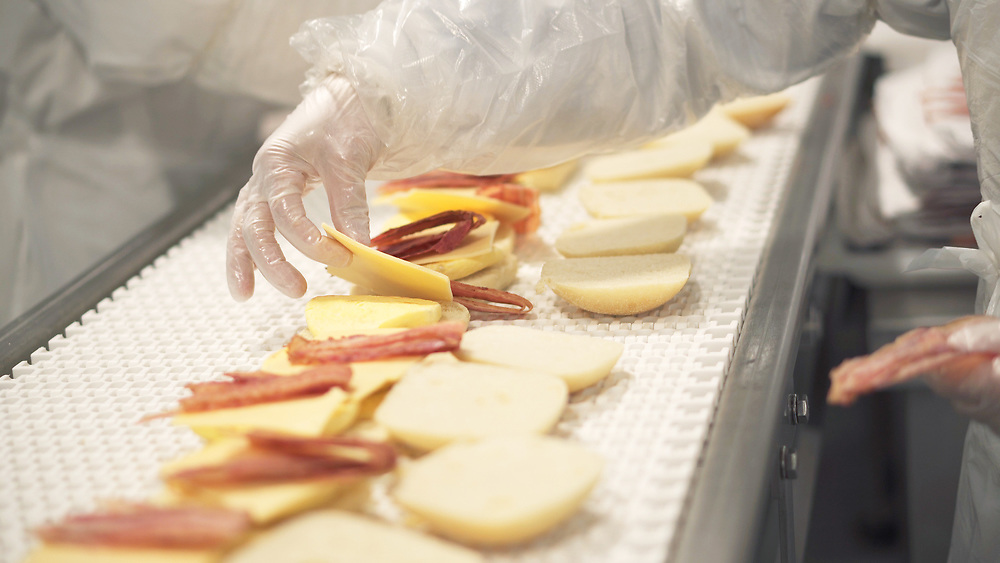 hand assembling food