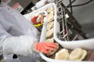 sandwiches coming down the assembly line