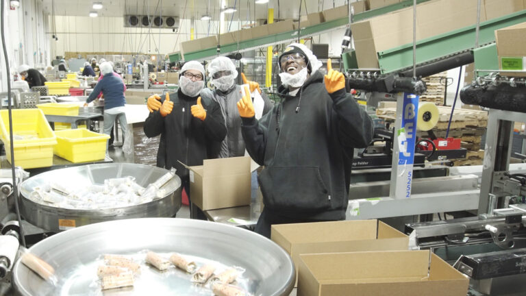 associates giving thumbs-ups