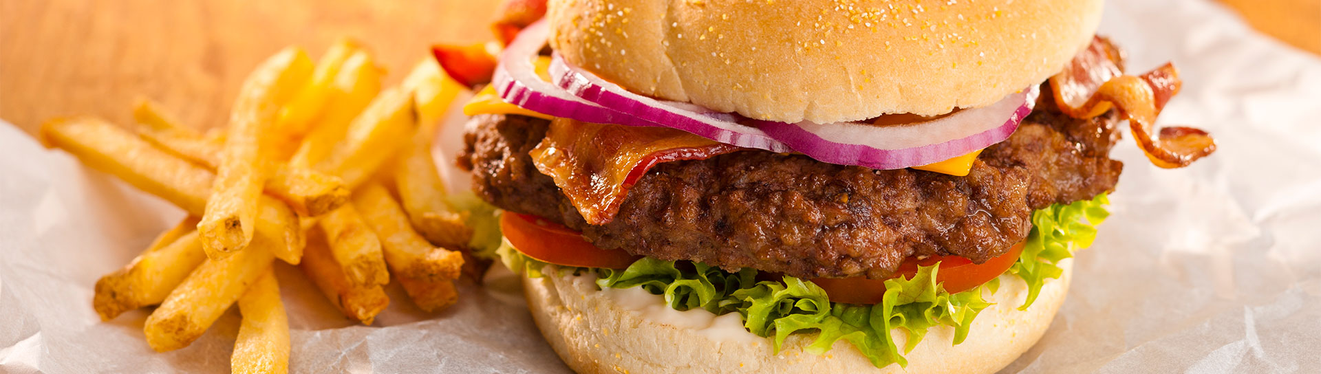 juicy hamburger with cheese on a kaiser roll